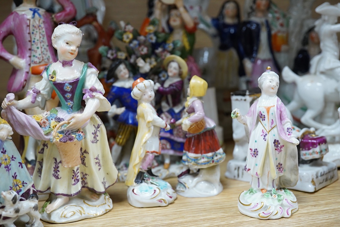 A collection of 19th century porcelain and ceramic figures, mostly Staffordshire, largest 28cm high